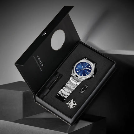 Northport Business Watch in gift box with stainless steel band and blue dial, showcasing minimalist design and complete calendar display.