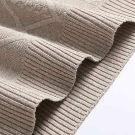 Close-up of Arezzo Sweater showcasing geometric weave and ribbed hem in soft cotton-wool blend. Ideal men's winter sweater for warmth and comfort.