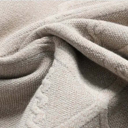 Close-up of Arezzo Sweater fabric showcasing geometric weave in a cotton-wool blend, ideal for men's winter knitwear and warm layering.
