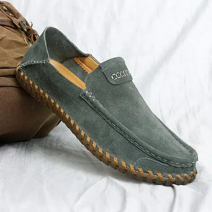 Elegant Aspen Suede Loafers in grey, showcasing premium suede craftsmanship for men's slip-on comfort and formal style.