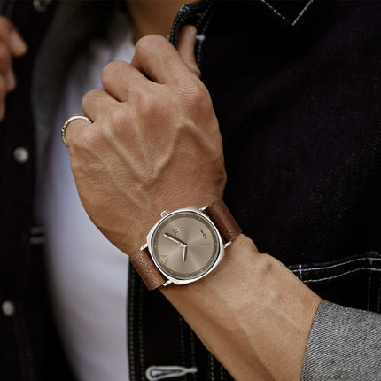 Man wearing Aurex Milano Heritage Leather Edition watch, displaying understated luxury and refined simplicity.