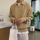 Man wearing Briar Quarter Zip Sweater, showcasing warm and cozy winter style, crafted from soft jacquard knit fabric for men's winter knitwear.