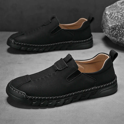Catania Genuine Leather Loafers with hand-stitched design, elastic sides, and rugged outsole, perfect for elegant slip-on comfort and formal style.