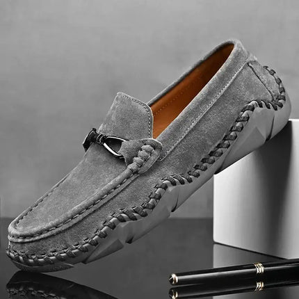 Elegant Fiorenzo Hand-Stitched Loafers in grey suede showcasing hand stitching, premium leather, and modern slip-on design for formal men's wear.