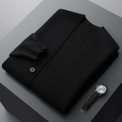 Giancarlo Cardigan folded in black, showcasing minimalist design with sleeve stripes, emphasizing warmth, comfort, and modern winter style.