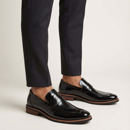 Montovani Leather Penny Loafers showcasing sleek design and luxury for men's formal attire.