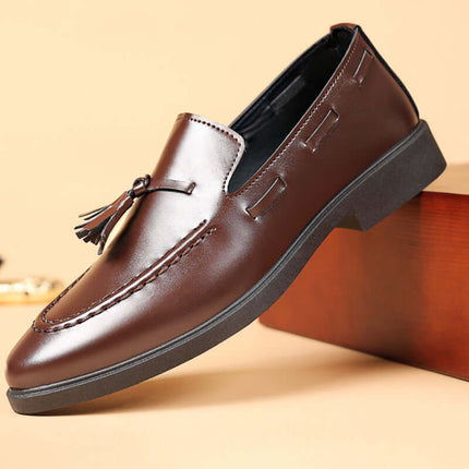 Valente Leather Tassel Loafers showcasing sleek design and tassel detail, ideal for elegant formal wear with slip-on comfort and synthetic leather finish.